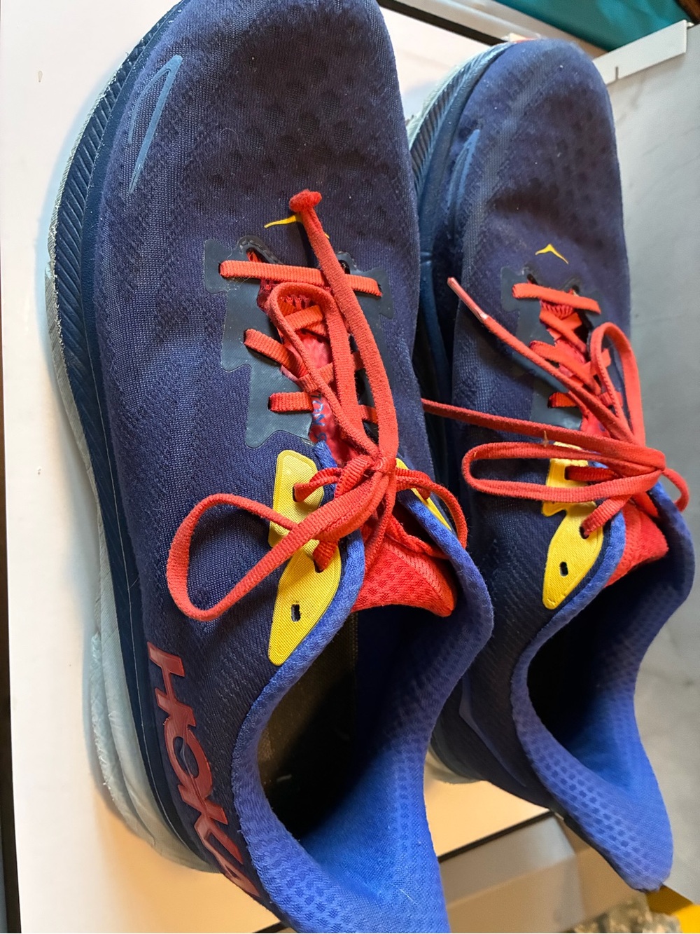 Hoka One One Men’s Blue Sneakers with Red Laces and Yellow Accents